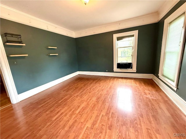 140 Maple St, Le Ray, NY 13612 - unfurnished room featuring crown molding, wood finished floors, baseboards, and cooling unit
