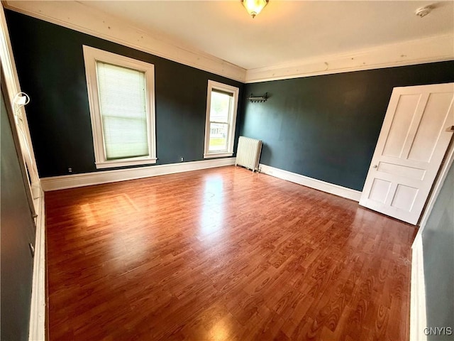 140 Maple St, Le Ray, NY 13612 - spare room with radiator, wood finished floors, a smoke detector, baseboards, and crown molding