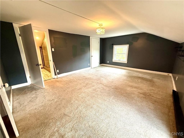140 Maple St, Le Ray, NY 13612 - unfurnished bedroom with carpet flooring, baseboards, and lofted ceiling