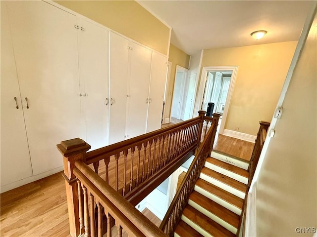 140 Maple St, Le Ray, NY 13612 - staircase featuring wood finished floors and baseboards