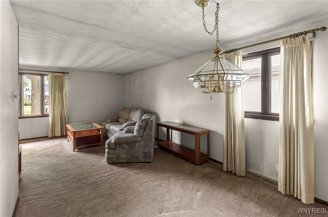 2923 N Ave, Niagara Falls, NY 14305 - sitting room with carpet floors, a chandelier, and baseboards