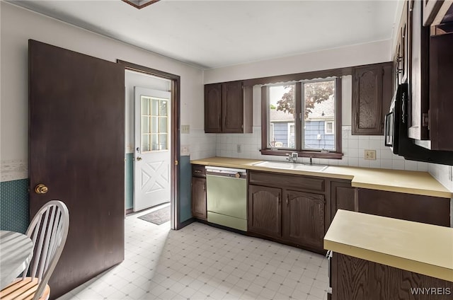 2923 N Ave, Niagara Falls, NY 14305 - kitchen with dishwashing machine, a sink, light countertops, and dark brown cabinets