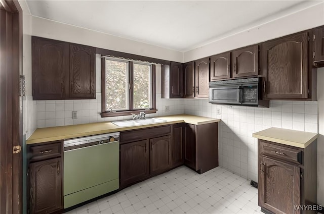2923 N Ave, Niagara Falls, NY 14305 - kitchen featuring dishwashing machine, black microwave, a sink, dark brown cabinets, and light countertops