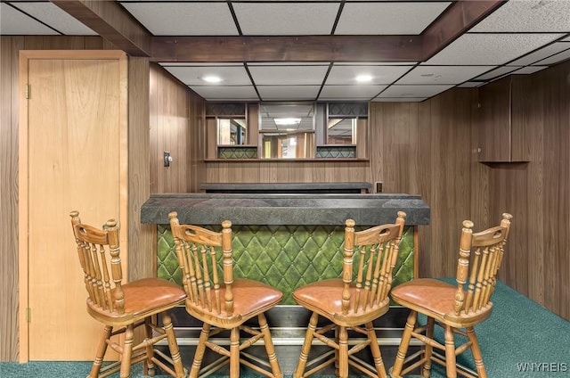 2923 N Ave, Niagara Falls, NY 14305 - indoor dry bar with wooden walls, carpet, and a paneled ceiling