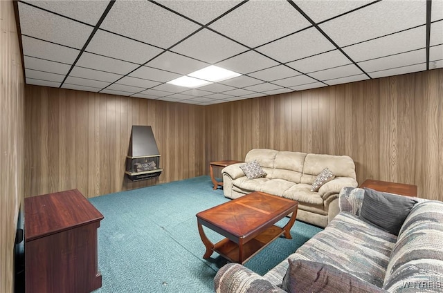 2923 N Ave, Niagara Falls, NY 14305 - carpeted living area with a paneled ceiling and wood walls