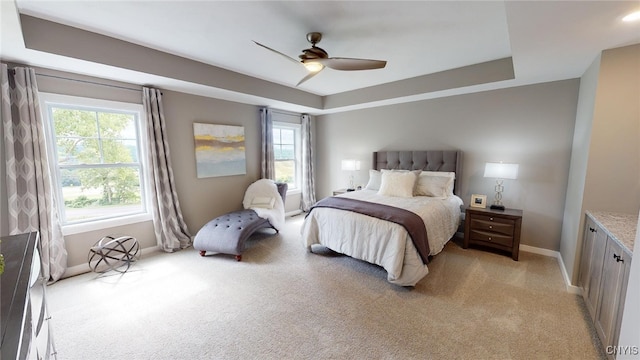 213 Lexi Ln, Van Buren, NY 13027 - bedroom featuring baseboards, light colored carpet, a raised ceiling, and a ceiling fan