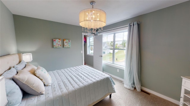 213 Lexi Ln, Van Buren, NY 13027 - carpeted bedroom with a chandelier and baseboards