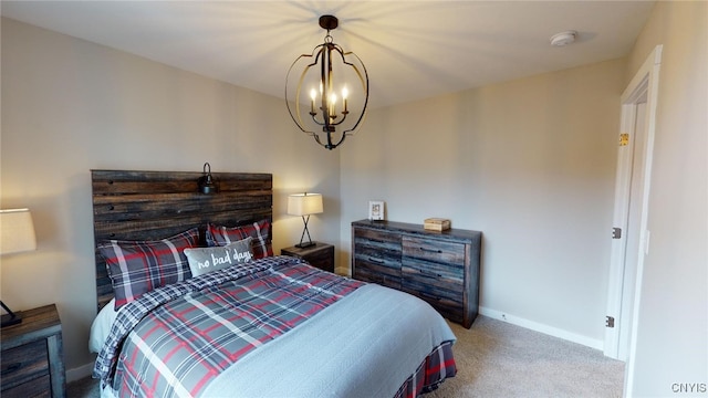213 Lexi Ln, Van Buren, NY 13027 - carpeted bedroom with baseboards and a chandelier