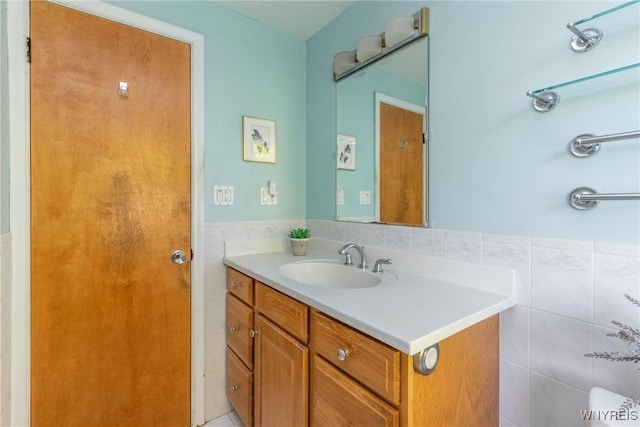 24 Glenbourne Ct, Amherst, NY 14221 - bathroom with vanity, tile walls, and a wainscoted wall