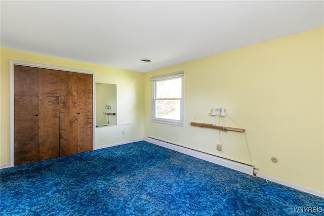 24 Glenbourne Ct, Amherst, NY 14221 - unfurnished bedroom featuring a baseboard heating unit, carpet, and baseboards