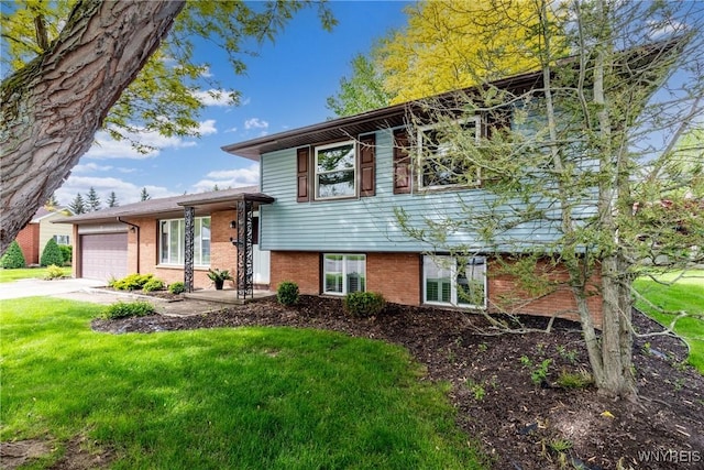24 Glenbourne Ct, Amherst, NY 14221 - tri-level home with an attached garage, brick siding, a front lawn, and concrete driveway