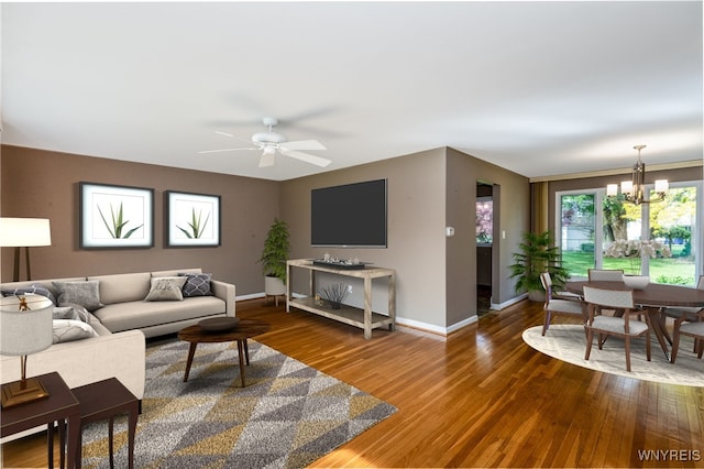24 Glenbourne Ct, Amherst, NY 14221 - living room featuring a chandelier, baseboards, wood finished floors, and a ceiling fan