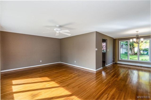 24 Glenbourne Ct, Amherst, NY 14221 - spare room with a chandelier, hardwood / wood-style floors, baseboards, and a ceiling fan