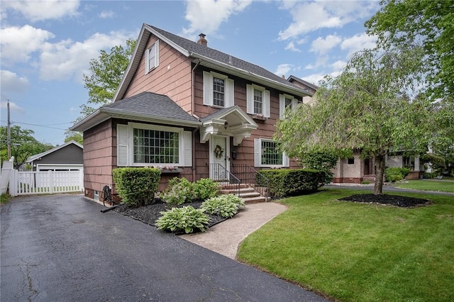 196 Elmcroft Rd, Rochester, NY 14609 - view of front of property with a shingled roof, a garage, an outbuilding, and a chimney