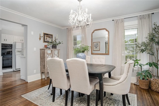 196 Elmcroft Rd, Rochester, NY 14609 - dining room with healthy amount of natural light, a chandelier, dark wood-type flooring, and ornamental molding