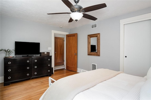 196 Elmcroft Rd, Rochester, NY 14609 - bedroom with light wood-type flooring, a closet, ceiling fan, and baseboards