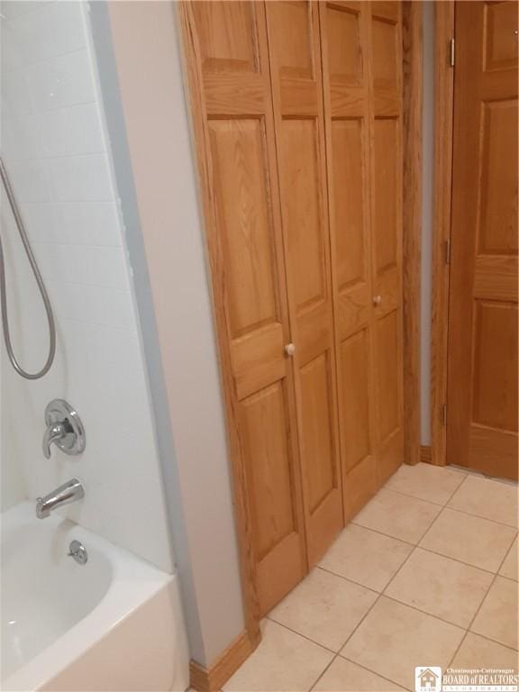 9165 Hebner Hill Rd, Otto, NY 14719 - bathroom with tile patterned flooring, shower / washtub combination, and a closet