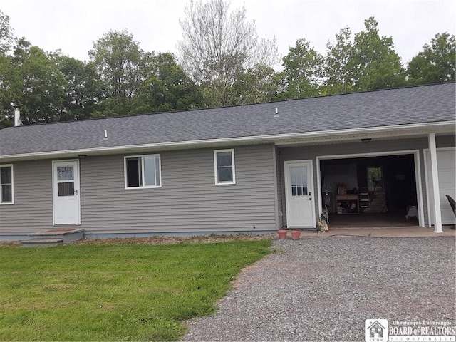 9165 Hebner Hill Rd, Otto, NY 14719 - ranch-style home featuring a front yard, an attached garage, a shingled roof, and gravel driveway
