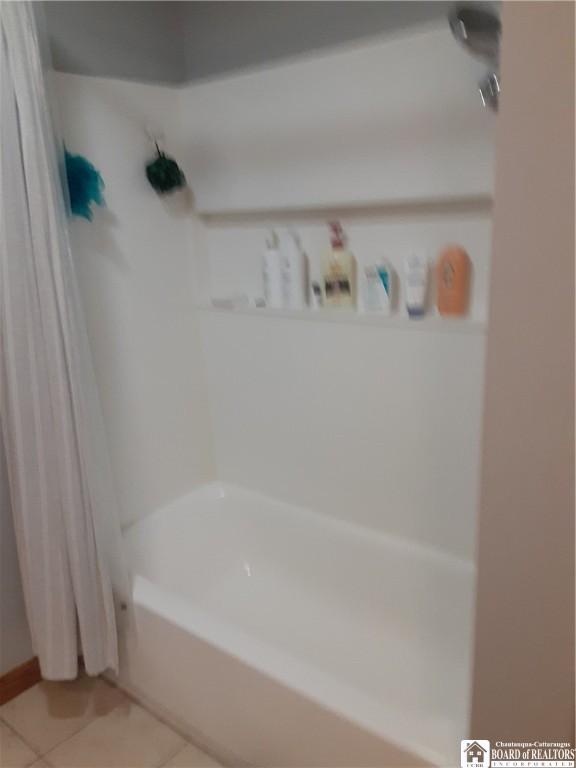 9165 Hebner Hill Rd, Otto, NY 14719 - bathroom featuring tile patterned flooring and shower / bathtub combination with curtain