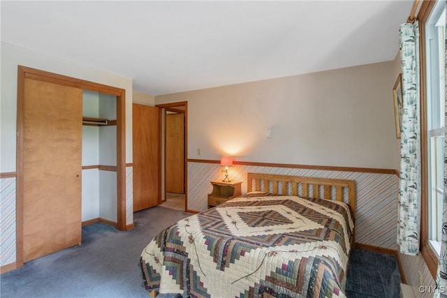 8974 Fenner Rd, Lysander, NY 13027 - carpeted bedroom featuring a closet and baseboards