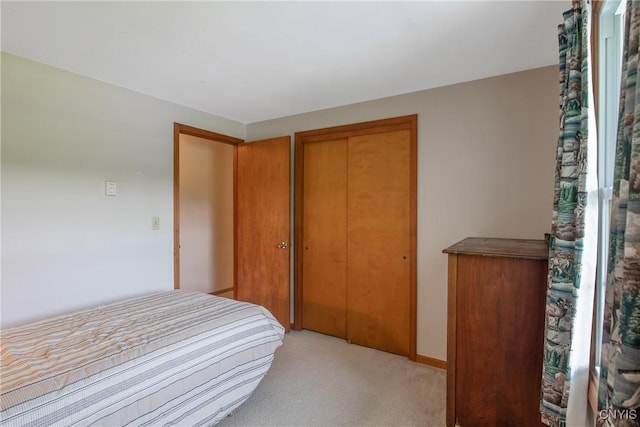 8974 Fenner Rd, Lysander, NY 13027 - bedroom with light colored carpet and a closet