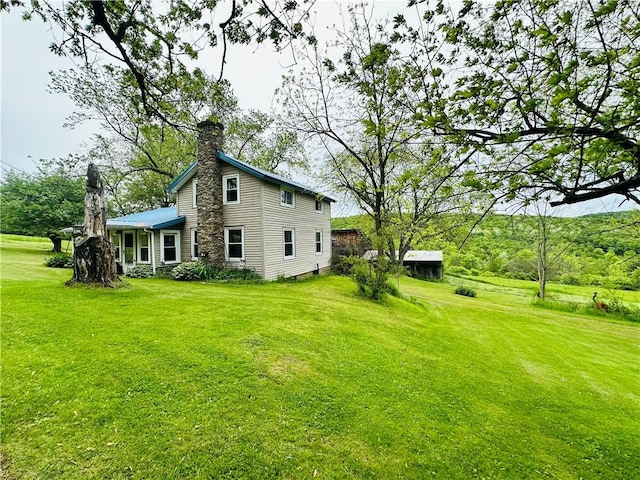 100 Demunn Rd, Catlin, NY 14812 - view of home's exterior featuring a chimney and a lawn