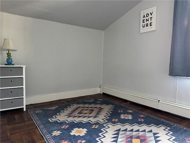 725 Emery St, Fulton, NY 13069 - empty room featuring a baseboard heating unit, baseboards, and vaulted ceiling