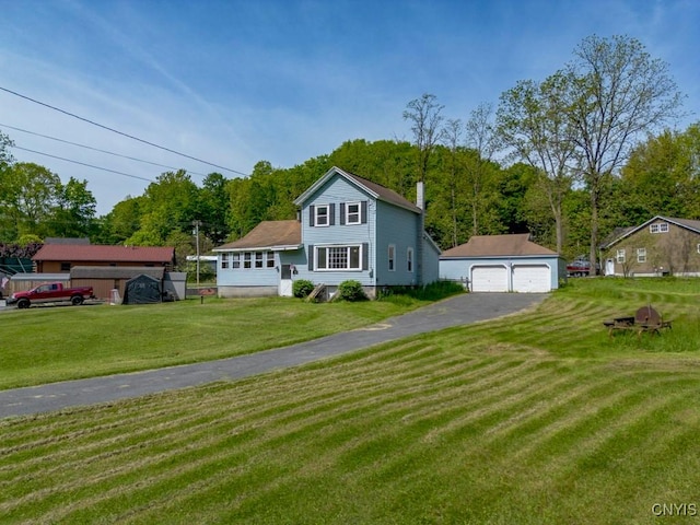 5333 Gulf Rd, Onondaga, NY 13031 - traditional home with a garage, an outdoor structure, a chimney, and a front yard