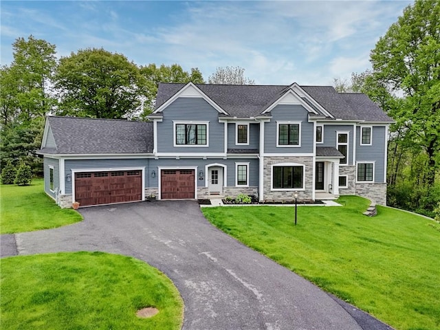 101 Coventry Rdg, Pittsford, NY 14534 - view of front facade with stone siding, asphalt driveway, a front yard, and an attached garage