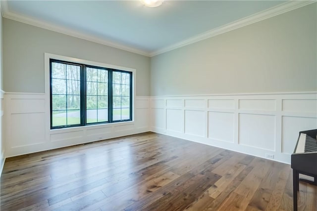 101 Coventry Rdg, Pittsford, NY 14534 - empty room featuring a decorative wall, ornamental molding, wood finished floors, and a wainscoted wall