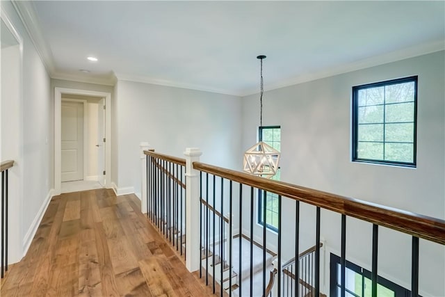 101 Coventry Rdg, Pittsford, NY 14534 - hall with an upstairs landing, crown molding, wood finished floors, baseboards, and recessed lighting