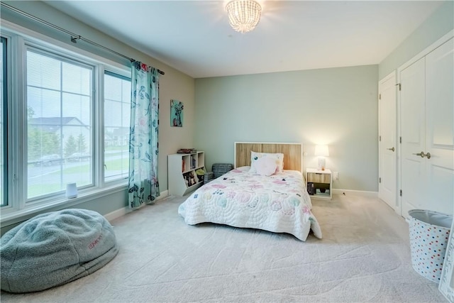 101 Coventry Rdg, Pittsford, NY 14534 - bedroom with multiple windows, baseboards, and light colored carpet