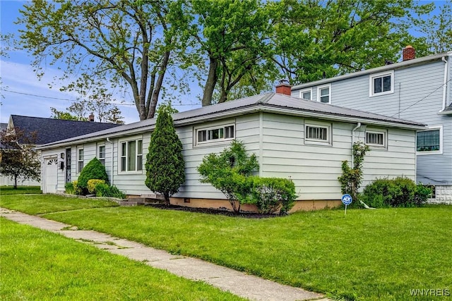 892 Northland Ave, Buffalo, NY 14215 - view of side of property featuring a lawn, a chimney, and metal roof