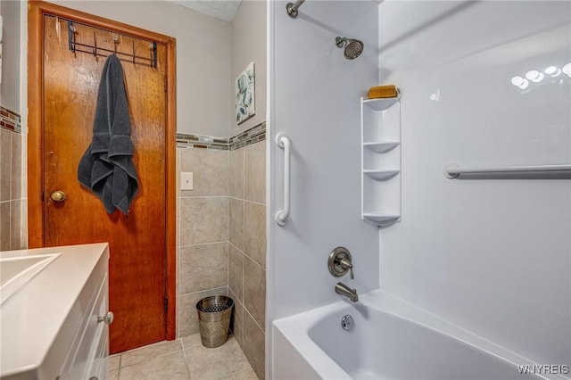 892 Northland Ave, Buffalo, NY 14215 - bathroom with vanity, shower / bathtub combination, tile patterned floors, and tile walls