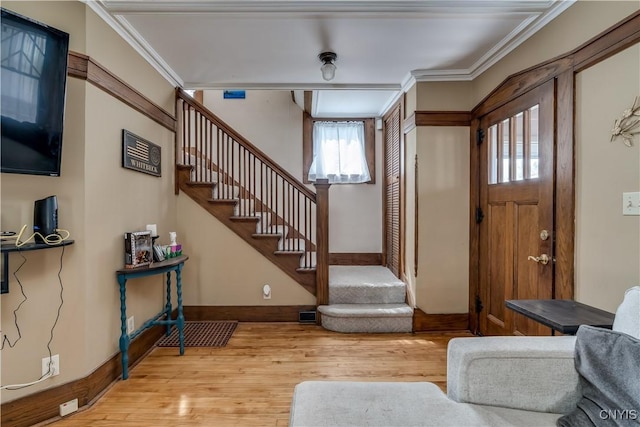 1105 Salina St, Watertown City, NY 13601 - foyer featuring light wood-style flooring, stairs, crown molding, and baseboards