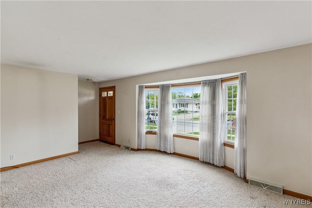 75 Greenmeadow Dr, West Seneca, NY 14224 - carpeted empty room featuring baseboards