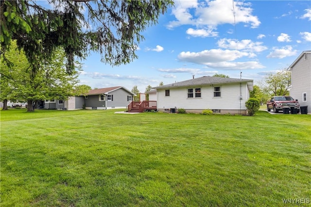 75 Greenmeadow Dr, West Seneca, NY 14224 - view of green lawn featuring a wooden deck