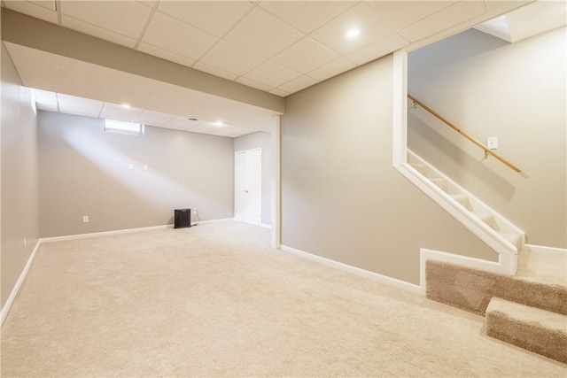1156 Channing Woods Dr, Webster, NY 14580 - finished below grade area with carpet, stairway, a drop ceiling, baseboards, and recessed lighting