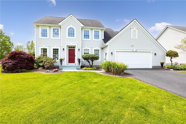 1156 Channing Woods Dr, Webster, NY 14580 - colonial house featuring driveway, an attached garage, and a front yard