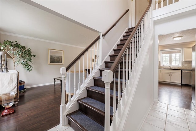 1156 Channing Woods Dr, Webster, NY 14580 - stairway featuring crown molding, baseboards, and wood finished floors
