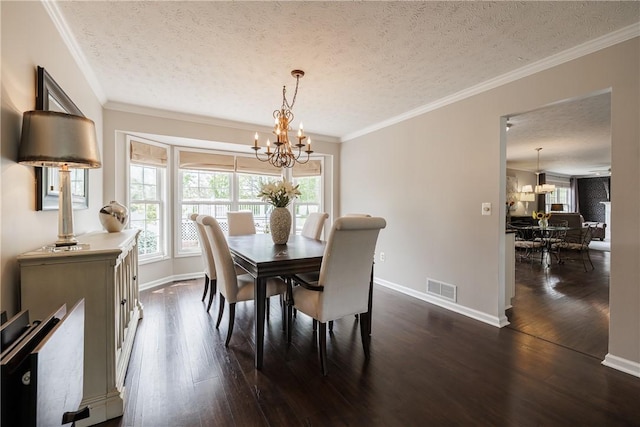 1156 Channing Woods Dr, Webster, NY 14580 - dining area featuring a chandelier, a textured ceiling, plenty of natural light, dark wood-type flooring, and ornamental molding
