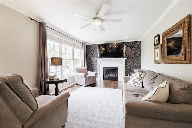 1156 Channing Woods Dr, Webster, NY 14580 - living room with crown molding, wood finished floors, a fireplace, a ceiling fan, and an accent wall