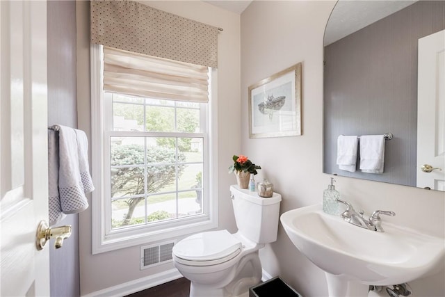 1156 Channing Woods Dr, Webster, NY 14580 - half bathroom with toilet, a sink, and baseboards