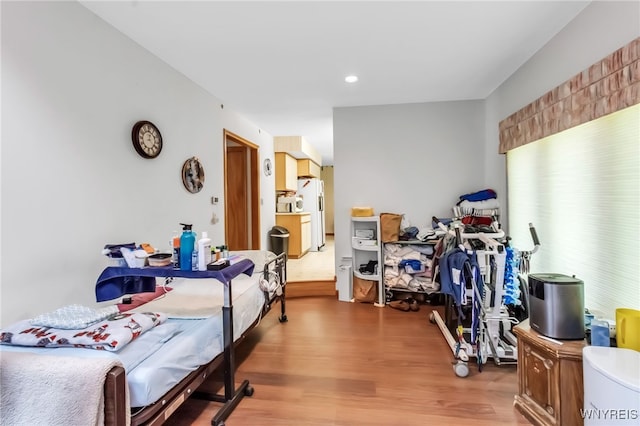113 Meadow Spring Ln, Amherst, NY 14051 - bedroom featuring wood finished floors, freestanding refrigerator, and recessed lighting
