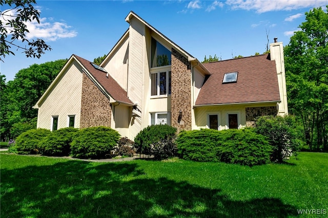 113 Meadow Spring Ln, Amherst, NY 14051 - rear view of property with a chimney and a yard