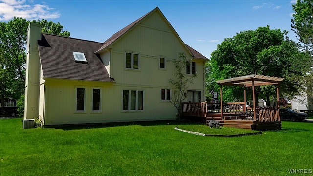 113 Meadow Spring Ln, Amherst, NY 14051 - back of property featuring a deck, a chimney, a lawn, cooling unit, and a shingled roof