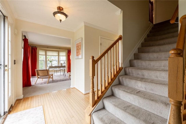 717 Westwood Trl, Walworth, NY 14502 - stairs with wood-type flooring, crown molding, and baseboards
