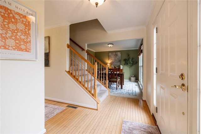 717 Westwood Trl, Walworth, NY 14502 - foyer with wood-type flooring, stairway, ornamental molding, and baseboards