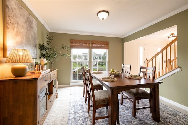 717 Westwood Trl, Walworth, NY 14502 - dining space with baseboards, light carpet, ornamental molding, and stairway