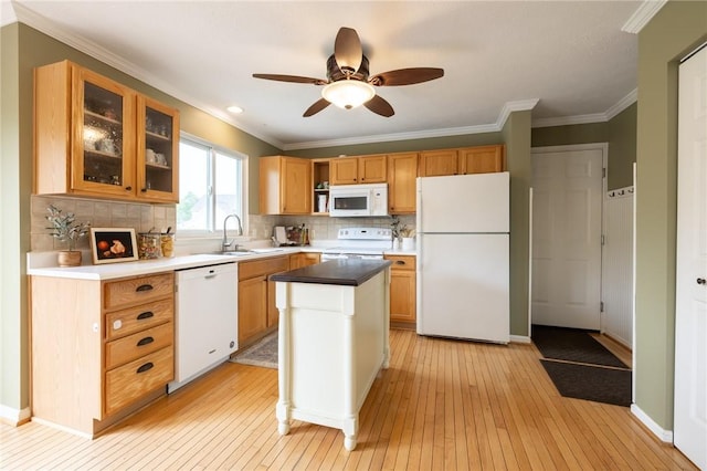 717 Westwood Trl, Walworth, NY 14502 - kitchen with white appliances, a sink, light wood-type flooring, decorative backsplash, and crown molding